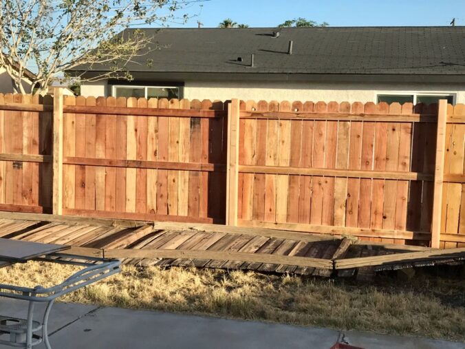 new fence with old fence on the ground